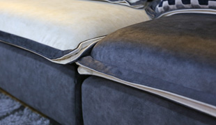 香河沃美克生产厂家小户型客厅轻奢后现代美式皮布结合转角沙发保养方法